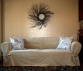 Tie arm slipcover in dessert sand velvet with accent pillows.